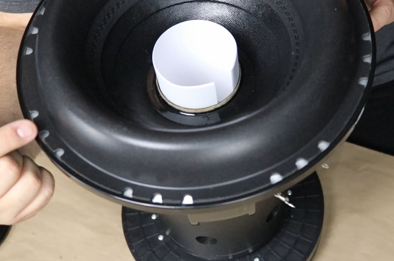 Sundown Audio subwoofer recone dry fit process showing proper alignment of cone, spider, and voice coil before gluing for accurate subwoofer repair and rebuild.